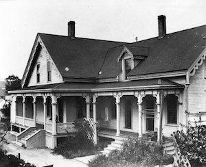 A Victorian home with gabled roof and front porch