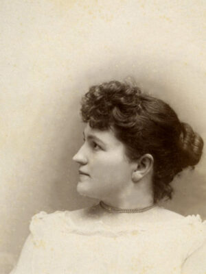 Studio portrait of a young woman with her face in profile