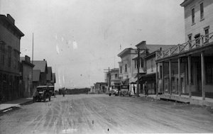 Street with buildings and cars on both sides