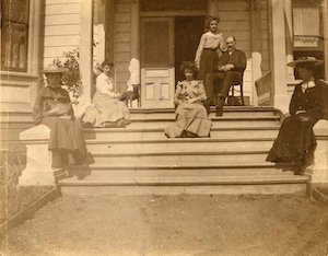 Milliken family sitting on house steps