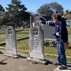 pioneer cemetery woman pointing - endocino historic district walking tour