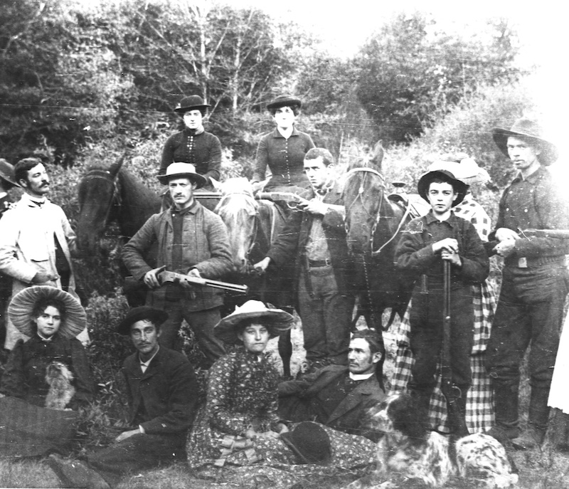 Group of young adults facing camera