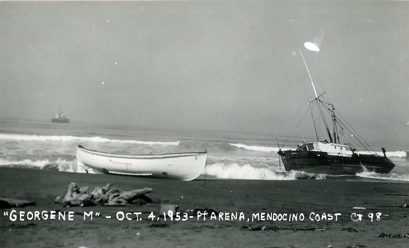 Fishing boat grounded on beach