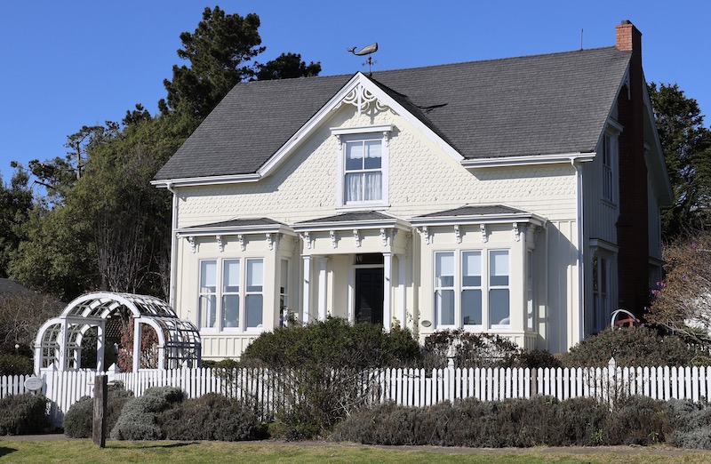 Historical house with a picket fence in front