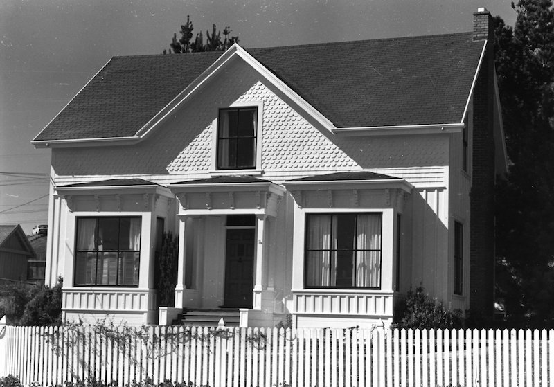 Historical house with a picket fence in front