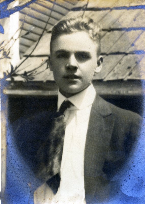 Photograph of a young man with jacket and tie