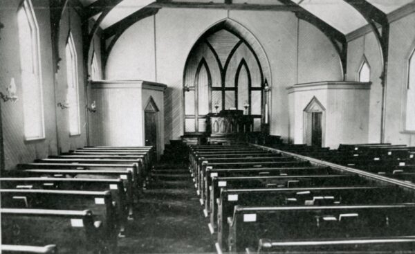 Church Interior with pews, looking towards front of chapel