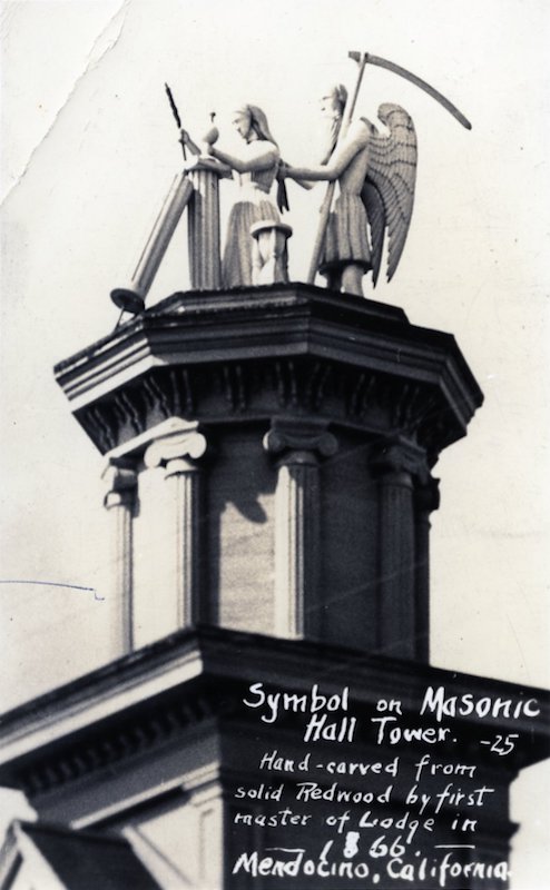 Statue on top of building depicting Father Time and a Maiden