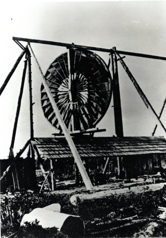 Large Windmill suspended over building