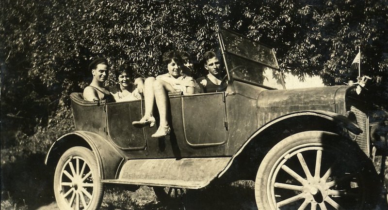 Young people in an old car