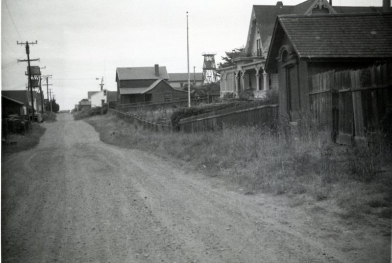 Black and White photo of a dirt street