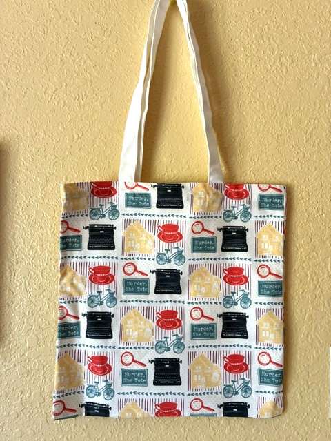 tote bag with illustrations of house, bike, typewriter