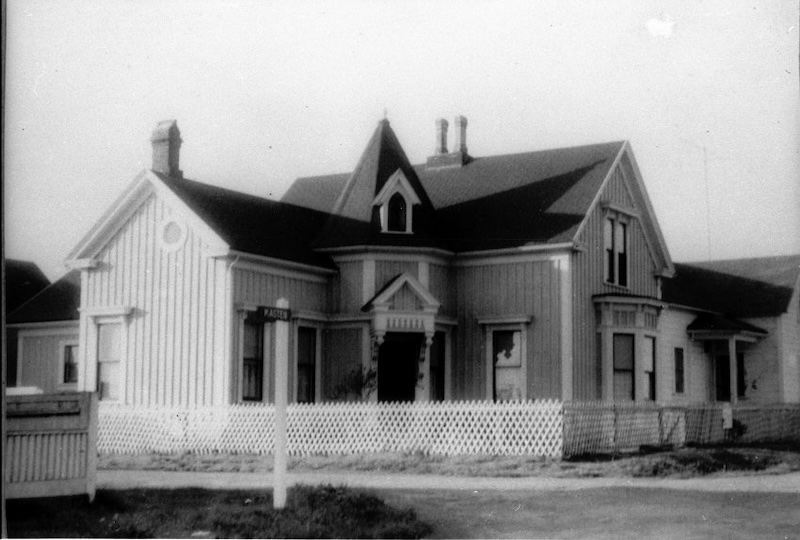Black and white photo of a historical house
