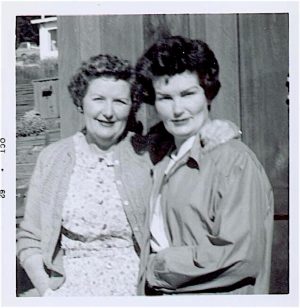 Two women face camera