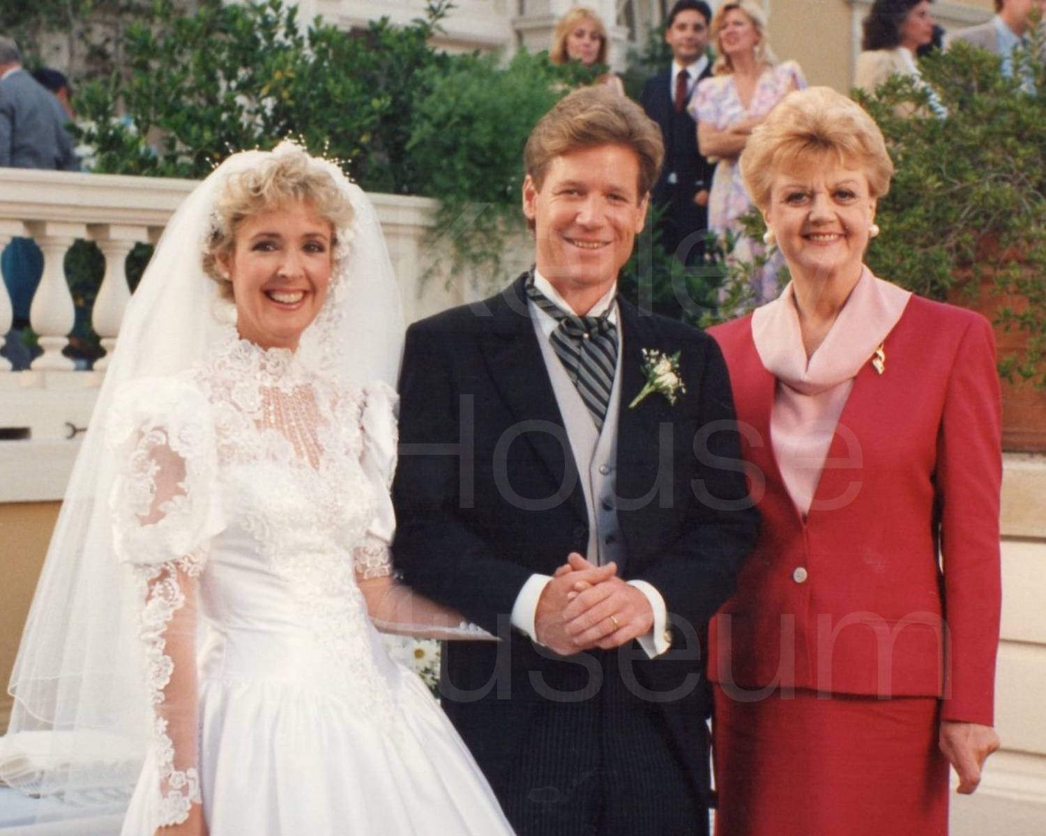 bride groom and jessica fletcher in red dress