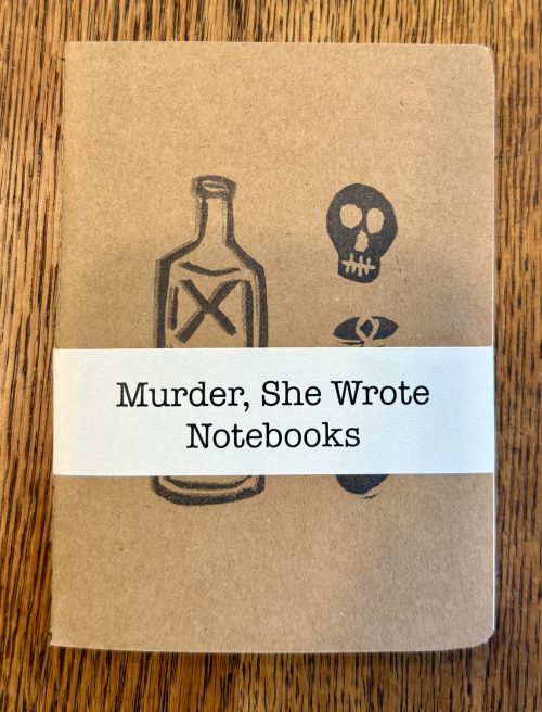 brown book with stamped images of bottle and skull