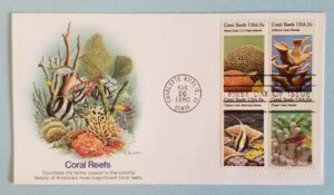 Several colorful images of coral reef stamps with a postmark