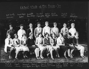Seated and standing young men and women posing for a photo labeled "Editorial Staff of the Boom - '28"