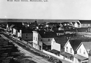 Elevated view of a street lined with buildings identified as "West Main Street, Mendocino, Cal."
