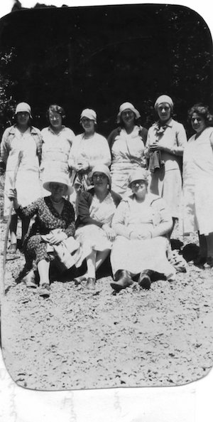 Group of women posing for a photo outdoors