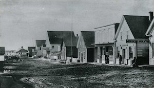 Buildings along a dirt street