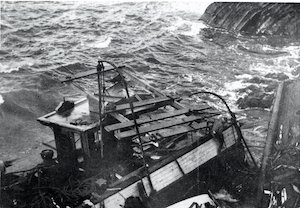 The wreckage of a boat in stormy waters