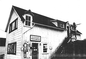 Two-story building with sign above the door for "Alphonso's Mercantile"
