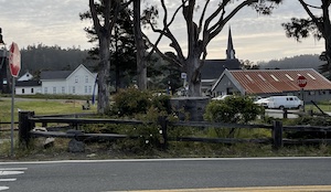 Street intersection with a stop sign and buildings in the background