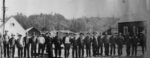 Big River Mill Crew, 1910. Cropped from a framed panoramic photograph of the Mendocino Lumber Company employees at Big River. The cookhouse is the building on the far right. Left to Right: Russell Anderson, John Larson, unidentified, unidentified, Ted Hanson, Frank Pacheco, Joe Brown, Charlie Escola, Louie Larsen, Joe Caroll, Frank Corria, Joe King Sr., Tony Fraga, John Silveria, Arthur Mathews Silva, Sam Bever, Frank Gonsalves, Bob Bever, Manuel Andre, Hercules Silva, “Big Boss” Charlie Knight. Standing behind Charlie Escola: Del Cole.