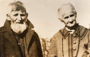 Elderly man and woman facing camera