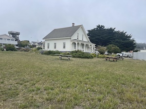 House in grassy field